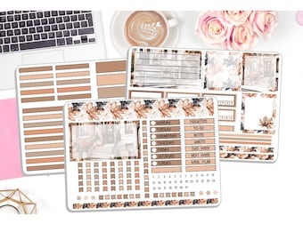 May include: A collection of planner stickers in shades of brown, beige, and white. The stickers feature leaf patterns, boxes, and labels for scheduling and organization. The image includes a laptop, coffee, and flowers.