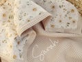 Waffle Baby Blanket with Name – Embroidered Name & Organic Cotton, Custom Newborn Gift, Beige Floral Blanket for Baby Girl product logo