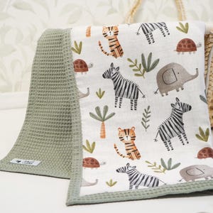 May include: A set of three ceramic mugs with a speckled, matte finish. The mugs are in shades of cream, light gray, and dark gray. Each mug has a simple, minimalist design, perfect for coffee or tea.