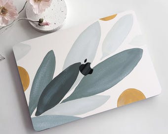 May include: A white laptop case with a design of blue and green leaves and yellow circles.