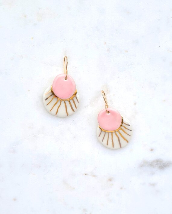 White and pink earrings top