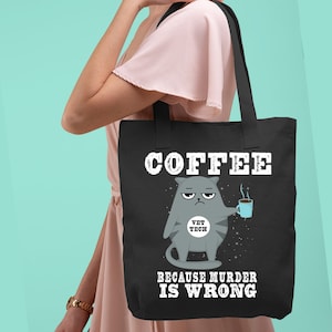 May include: Black tote bag with a white graphic of a cartoon cat holding a cup of coffee. The text "COFFEE BECAUSE MURDER IS WRONG" is printed below the cat. The cat has a badge that says "VET TECH".