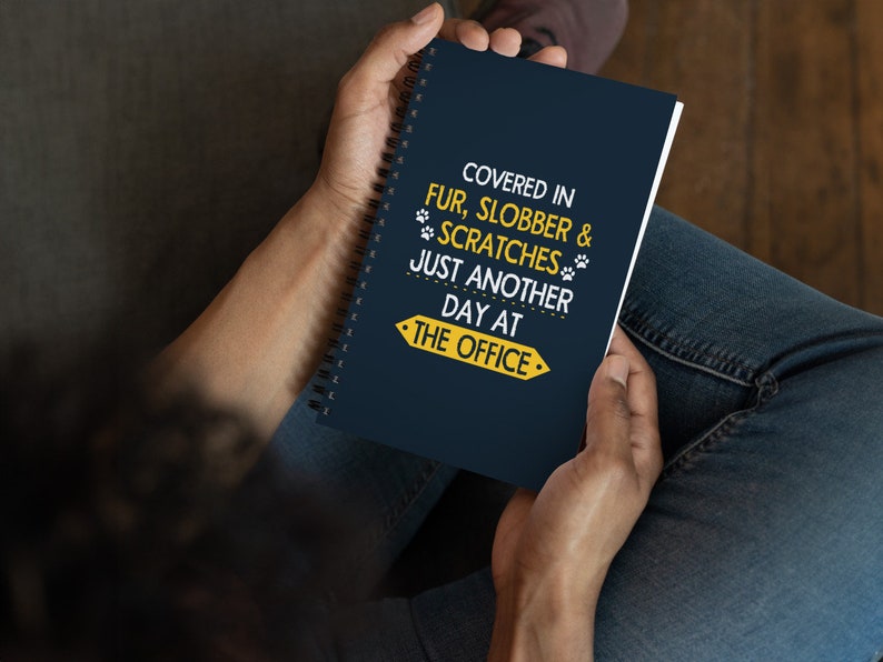 a person sitting on a couch holding a book