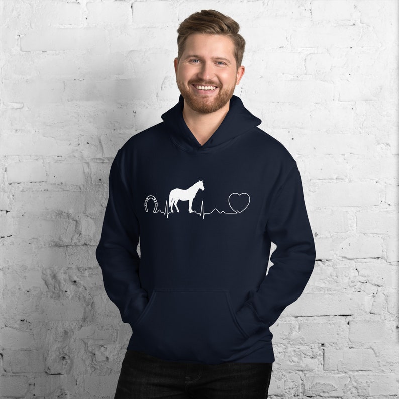 May include: A navy blue hoodie with a white horseshoe, a white horse, a white heart, and a white heartbeat line graphic. The graphic reads "Horseshoe Heartbeat".