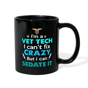 May include: Black coffee mug with a white graphic that reads "I'm a Vet Tech I can't fix crazy but I can sedate it". The graphic also includes a paw print, a caduceus symbol, and two syringes.