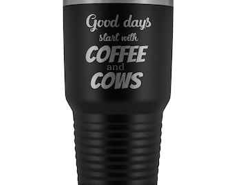 May include: Black stainless steel tumbler with a silver lid. The tumbler has a white inscription that reads "Good days start with COFFEE and COWS".