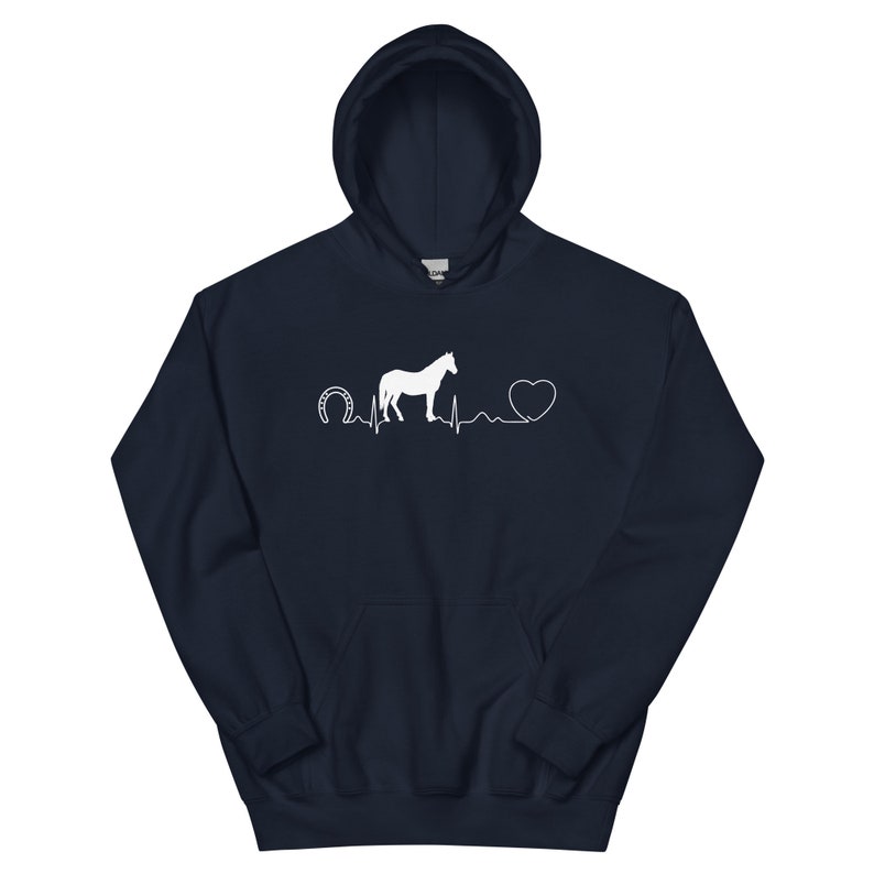 May include: A navy blue hoodie featuring a white horse, horseshoe and heart graphic. The graphic shows a horse silhouette with a heartbeat line, a horseshoe at the start of the line and a heart at the end of the line.