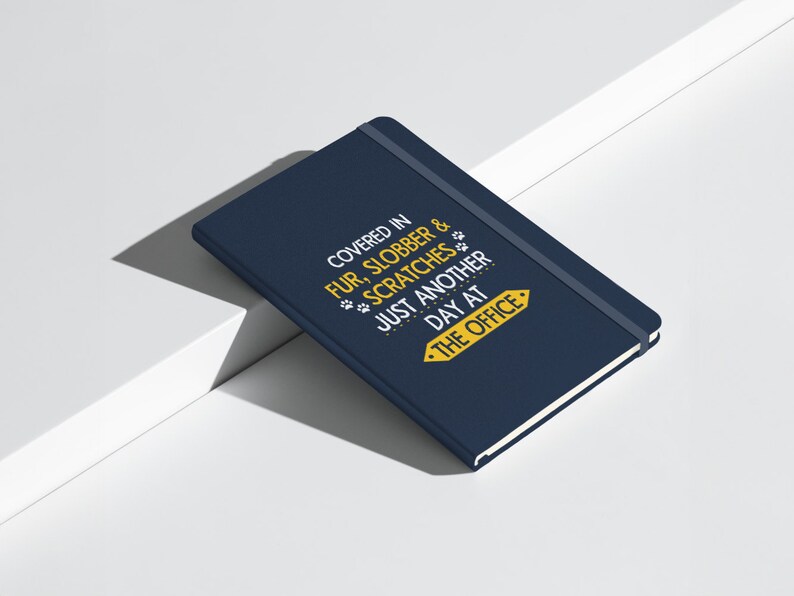 a blue book sitting on top of a white table