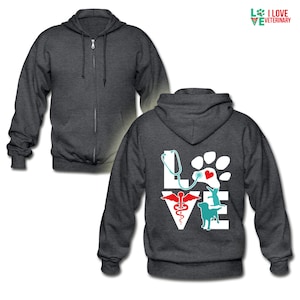 May include: A dark gray zippered hoodie with a white graphic on the back that says "I LOVE VETERINARY" with a stethoscope, paw print, heart, and a caduceus with wings.