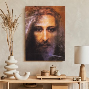 Peut inclure: Une impression de style vintage d'un visage d'homme avec une lueur douce et éthérée. L'image est imprimée sur toile et a un effet texturé et pictural.