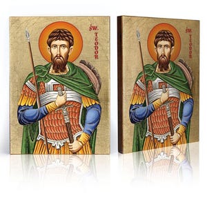 Pode incluir: Um par de ícones de madeira que representam São Teodoro, um santo cristão. Os ícones são pintados em um estilo tradicional com fundos dourados e apresentam o santo com armadura segurando uma espada e uma lança. O texto "św. Teodor" está escrito em cada ícone.