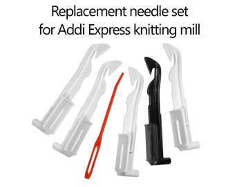 May include: Replacement needle set for Addi Express knitting mill. The set includes four white plastic needles, one black plastic needle, and one thin orange plastic needle with an eyelet, all featuring hooked ends for machine knitting.