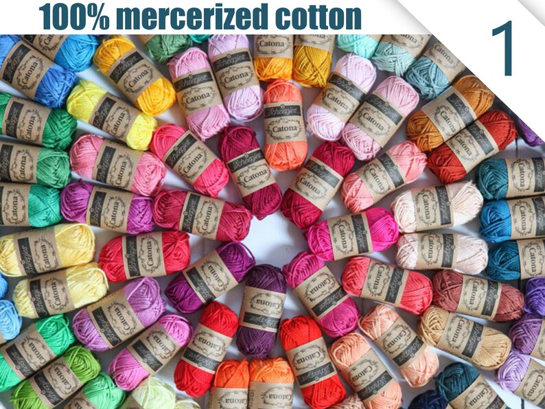 May include: A collection of colorful yarn skeins arranged in a circular pattern. The yarn is labeled "Catona" and is available in various shades, including blue, green, yellow, pink, and red. The text "100% mercerized cotton" is visible.