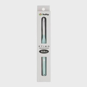 May include: A Tulip Etimo Grandhook crochet hook with a light blue handle and a white hook tip, packaged in a vertical white box. The packaging displays the brand name Tulip, the product name Etimo Grandhook, and the size 8.0mm in black text.