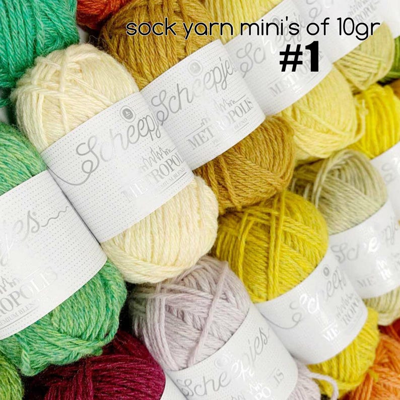 May include: A close-up of a variety of colorful yarn skeins, each labeled "Scheepjes" and "Wolle mit Metropol" with the text "sock yarn mini's of 10gr #1".