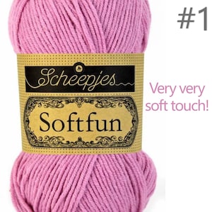 May include: A skein of pink yarn with a tan paper label featuring the text Scheepjes Softfun, the number 1, and the phrase Very very soft touch. The yarn is wound into a thick, textured ball with visible strands and a consistent light pink colour.