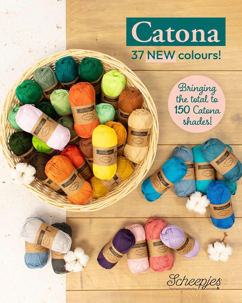 May include: A wicker basket filled with colorful yarn balls in shades of green, orange, yellow, and brown. Additional yarn balls in blue, purple, and pink are scattered around the basket. The text "Catona" and "37 NEW colours!" are visible.