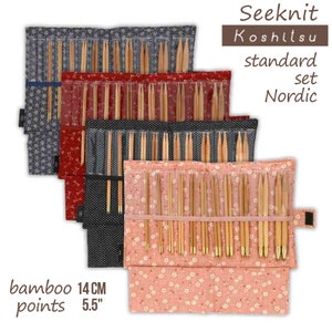 May include: A set of 14 cm (5.5 inch) bamboo knitting needles in a pink floral case. The needles are arranged in rows and are labeled "Seeknit Koshitsu standard set Nordic".