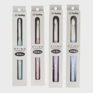 May include: Four Tulip Etimo Grandhook crochet hooks in individual white retail boxes. The hooks are sized 8.0mm, 10.0mm, 12.0mm, and 15.0mm, featuring pastel-colored handles in light blue, pink, lavender, and blue with white hook heads.