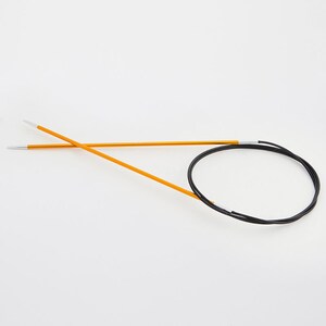 May include: A pair of orange circular knitting needles with silver tips and a black cable. The needles are made of metal and are designed for knitting projects. The needles are shown against a white background.