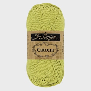 May include: A skein of light green Scheepjes Catona cotton yarn. The yarn is wrapped with a brown label featuring the brand name and product name. The yarn is a solid, vibrant green color.