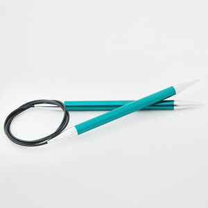 May include: Teal circular knitting needles with silver tips and a black cable. The needles are made of metal and have a smooth, shiny finish. The needles are designed for knitting in the round and are a popular choice for various projects.
