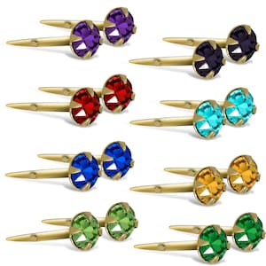 May include: Set of ten gold cufflinks with colorful crystal accents. The cufflinks feature a variety of colors, including purple, red, blue, turquoise, orange, and green.
