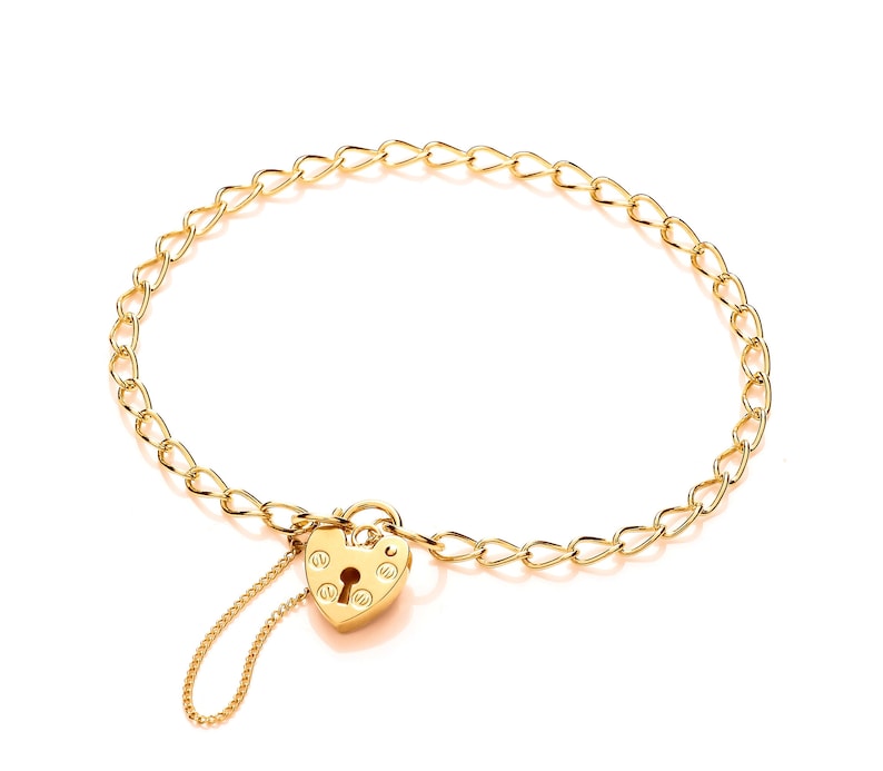 May include: A gold chain bracelet with a heart-shaped padlock charm. The padlock has a keyhole and decorative details.