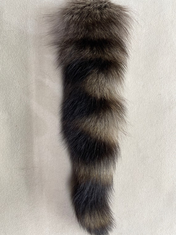 Raccoon tail shop keychain