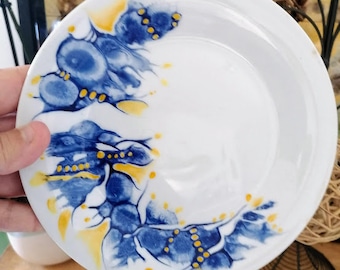 dessert plate with dominant blue, empty pocket, round, porcelain, intuitive painting, hand painted, unique, luxury French craftsmanship