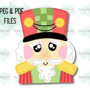 May include: A cartoon nutcracker soldier in red and green, with a black hat and a happy face. The image includes the text "JPEG & PDF FILES". The design has gold details and a white background. A festive design.