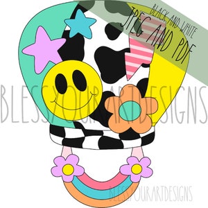Könnte beinhalten: Ein farbenfrohes Heißluftballon-Design mit einem Kuhmuster, einem Smiley, einem Regenbogen und Blumen. Der Ballon ist in den Farben Hellblau, Gelb und Rosa gefüllt.