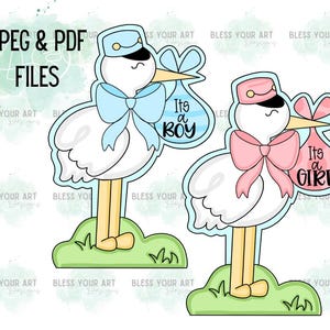 May include: Two stork baby shower cutouts, one blue and one pink. The blue stork holds a blue and white bag that says "It's a Boy". The pink stork holds a pink and white bag that says "It's a Girl".