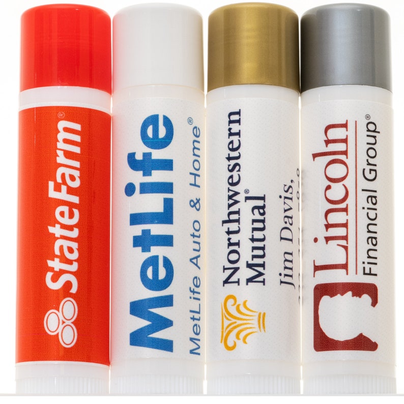 May include: Four lip balm tubes with different company logos. The tubes are white with red, blue, gold, and silver caps. The logos are State Farm, MetLife Auto & Home, Northwestern Mutual, and Lincoln Financial Group.