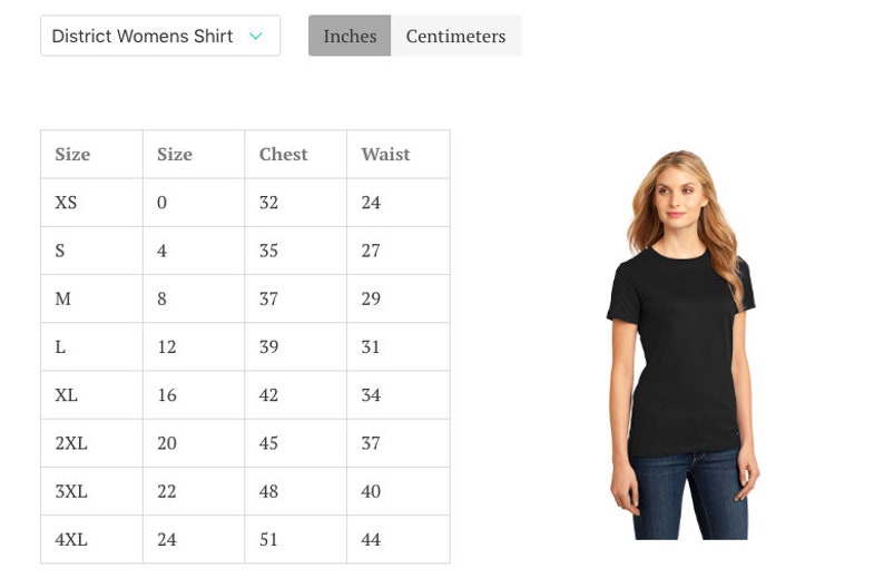 May include: Black District Women's Shirt with a size chart showing chest and waist measurements in inches. The model is wearing a black t-shirt and blue jeans. The size chart includes sizes XS to 4XL.