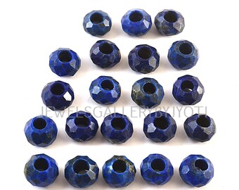 May include: A collection of 18 faceted lapis lazuli beads, each with a hole in the center. The beads are a deep blue color with a slight variation in shade. The beads are arranged in a semi-circle pattern on a white surface.