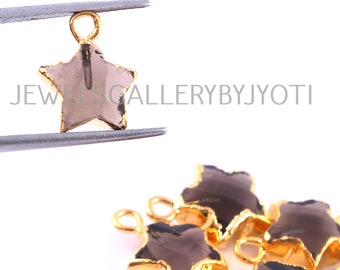 May include: Five gold-plated star-shaped charms with smoky quartz gemstones. Each charm has a loop for attaching to jewelry.