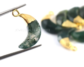 May include: Green agate crescent moon pendant with gold plated edges. The pendant has a loop at the top for attaching to a chain or cord.