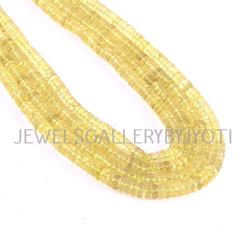 May include: Several strands of yellow gemstone beads. The beads are small, square-cut, and have a slightly translucent appearance. The image includes the text "JEWELSGALLERYBYJYOTI".