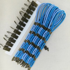 Set med 12 sidospännare för broderiramar/Scroll Rod Sidospännklämmor