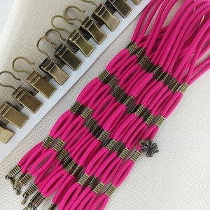 Set med 12 sidospännare för broderiramar/Scroll Rod Sidospännklämmor
