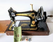 28k Singer Sewing Machine made in 1937, with fold down table, original bell shaped wooden case with key and instruction booklet