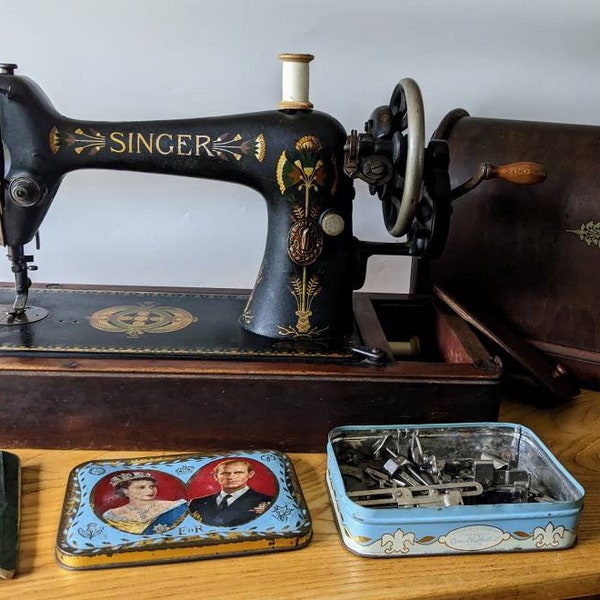 Beautiful 1917 antique Singer sewing machine model 66K with lotus design, original instructions, accessories in collectable tin and oak case