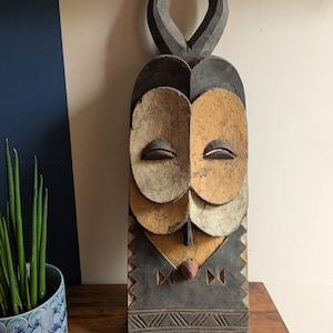 Large vintage carved wooden horned Bembe mask from D.R. Congo
