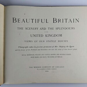 May include: A book cover with the title "Beautiful Britain: The Scenery and the Splendours of the United Kingdom" and a subtitle "Views of Our Stately Houses". The book cover also includes the text "Photographs taken by gracious permission of Her Majesty the Queen and by favour of the Noblemen and Gentlemen who now own many of these historic places." and "Royal Residences, Palaces and Castles, Bowers and Hunting-Lodges, River Banks and Belts, the Homes of Princes."