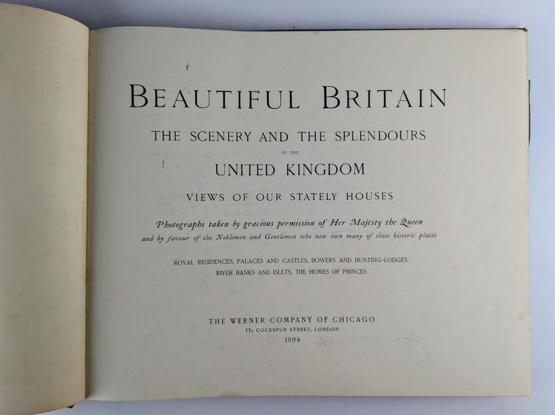 May include: A book cover with the title "Beautiful Britain: The Scenery and the Splendours of the United Kingdom" and a subtitle "Views of Our Stately Houses". The book cover also includes the text "Photographs taken by gracious permission of Her Majesty the Queen and by favour of the Noblemen and Gentlemen who now own many of these historic places." and "Royal Residences, Palaces and Castles, Bowers and Hunting-Lodges, River Banks and Belts, the Homes of Princes."
