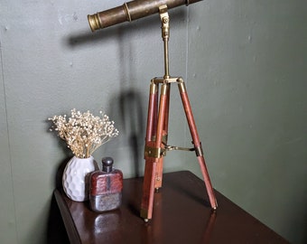 Vintage brass telescope on brass and teak tripod