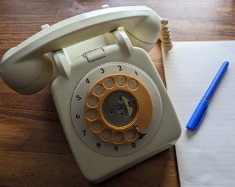 1970s cream coloured telephone, rotary dial telephone