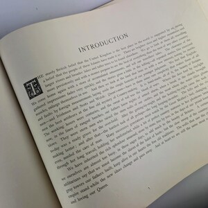 May include: A vintage book with a brown cover and gold lettering. The title of the book is "Introduction". The text on the page discusses the beauty of the United Kingdom and its history.