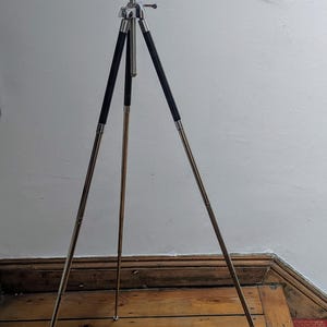 Vintage camera tripod with leather case
